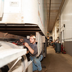 Man Working On Vechicle